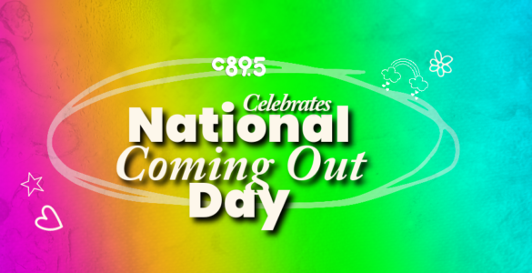 A rainbow background with the words "C895 Celebrating National Coming Out Day"