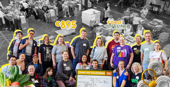 Group of volunteers at Food Lifeline, smiling and posing in a warehouse setting surrounded by boxes and canned goods, with a banner displaying gratitude and statistics about volunteer efforts.
