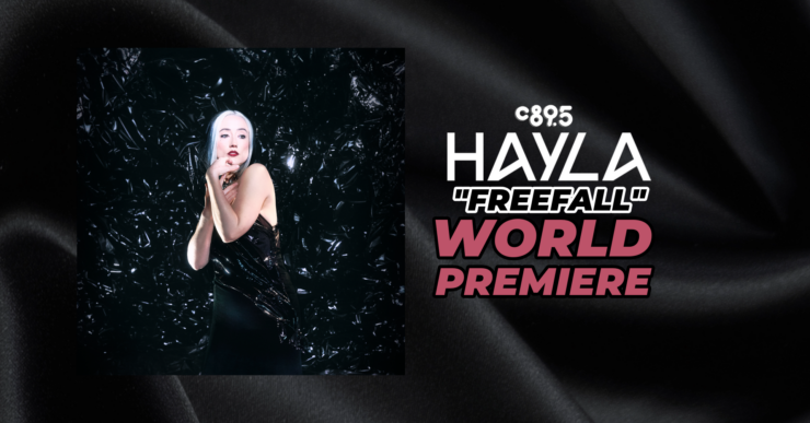 Promotional banner featuring the artist Hayla at the world premiere of "Freefall," highlighted by the C895 logo, set against a sleek, dark background with shimmering textures.