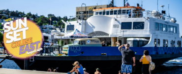 A large white ferry named "Hi-Yu" docked at a sunny waterfront, with people nearby enjoying the outdoors. A bright graphic on the left advertises a "SUN SET CRUISE August 8th.