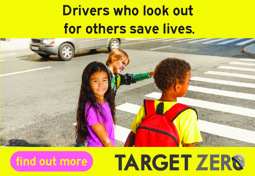 Three children at a crosswalk, smiling and interacting, with a message saying 'Drivers who look out for others save lives.' and logos of 'find out more' and 'TARGET ZERO.'