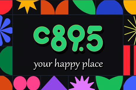 A graphic image with a green c89.5 logo on a black background with festive colors around the borders and the words "Your Happy Place" beneath the logo