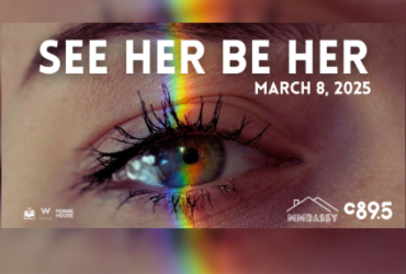 Close-up of an eye with a rainbow reflection across it, promoting the 'See Her Be Her' event on March 8, 2025, sponsored by Femme House and MMBASSY, with a C895 logo.