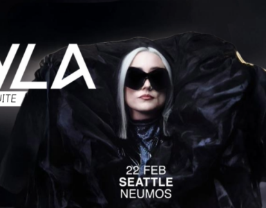 Promotional banner featuring the artist HAYLA, announced to perform live at The Sound Suite, W Seattle, on February 22 at Neumos. The image shows HAYLA wearing a large black outfit and sunglasses, set against a dark background.