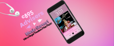 Promotional banner featuring a smartphone displaying Dua Lipa's album on its screen, accompanied by headphones and text announcing a music survey with a chance to win a Regal Theater Prize Pack.