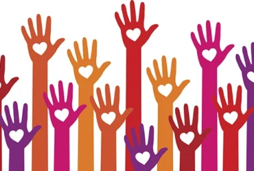 a graphic of multi-colored hands held up high, with a heart silhouette in the palm of each hand.